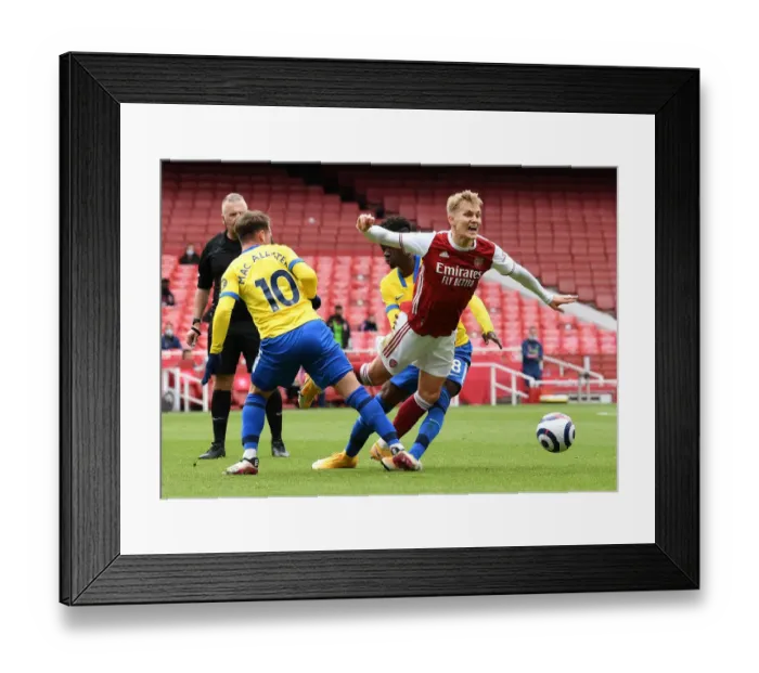 Framed Print : Arsenal vs Brighton: Intense Battle at Emirates Stadium