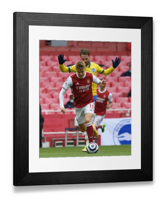 Framed Print : Odegaard vs Mac Allister: A Premier League Battle at Emirates Stadium
