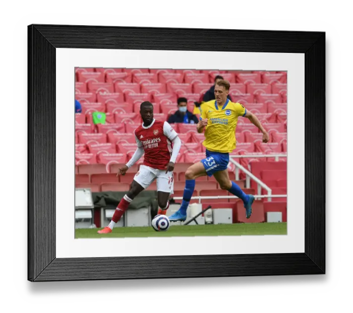 Framed Print : Pepe vs Burn: Arsenal's Battle at Emirates Against Brighton (2020-21) Framed Print : Pepe vs Burn: Arsenal's Battle at Emirates Against Brighton (2020-21)