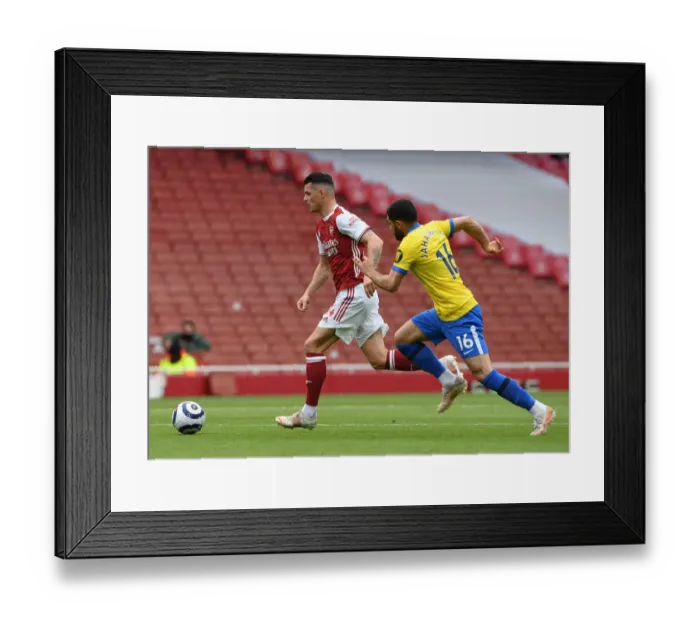 Framed Print : Xhaka vs. Jahanbakhsh: Intense Clash in Arsenal vs. Brighton Premier League Battle (2020-21)