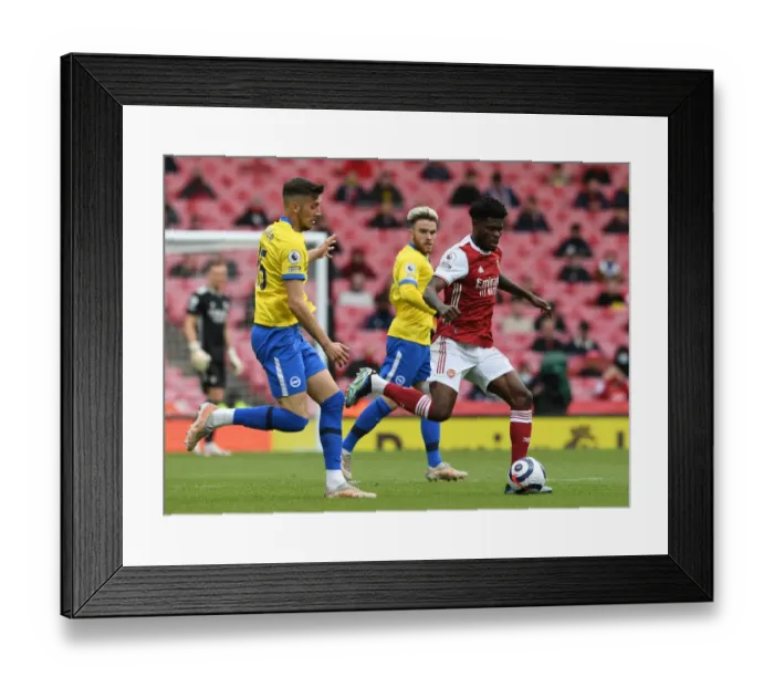 Framed Print : Arsenal vs Brighton: Thomas Partey Clashes with Jakub Moder in Premier League Showdown (2020-21) Framed Print : Arsenal vs Brighton: Thomas Partey Clashes with Jakub Moder in Premier League Showdown (2020-21)