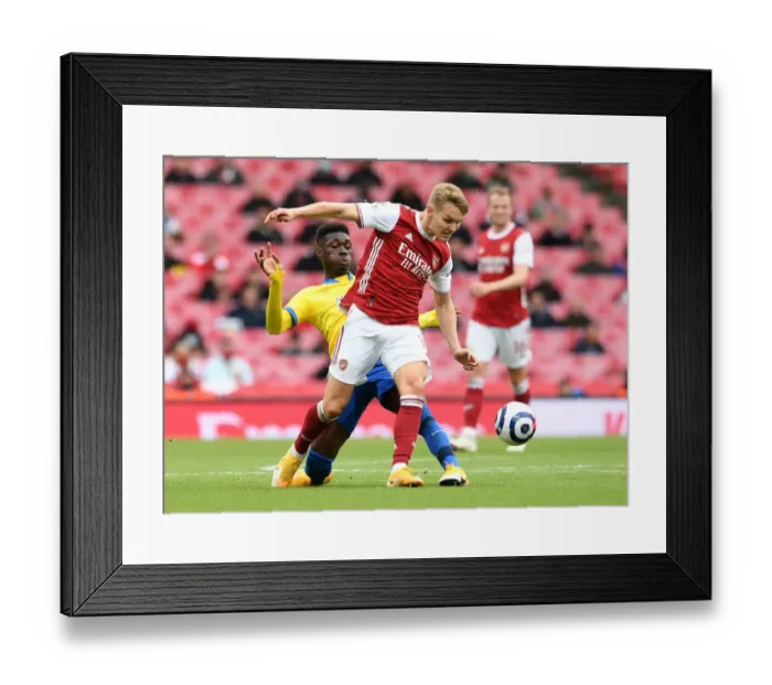 Framed Print : Odegaard vs Bissouma: A Premier League Showdown at Emirates Stadium (2020-21)