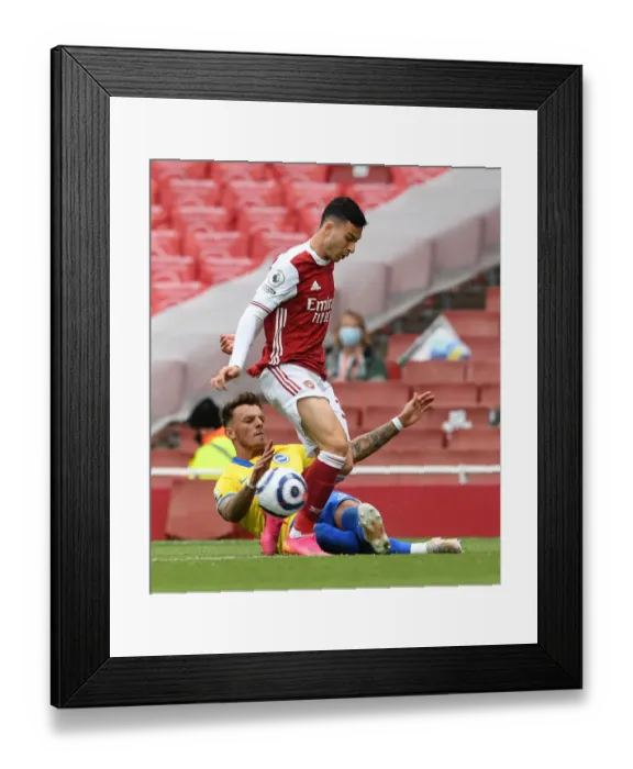 Framed Print : Arsenal vs Brighton: Magalhaes Tackled by White in Intense Premier League Clash (2020-21) Framed Print : Arsenal vs Brighton: Magalhaes Tackled by White in Intense Premier League Clash (2020-21)