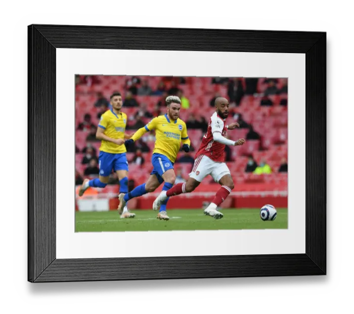 Framed Print : Arsenal vs Brighton: Lacazette vs Connolly - Premier League Showdown: A Battle of Stars at Emirates Stadium