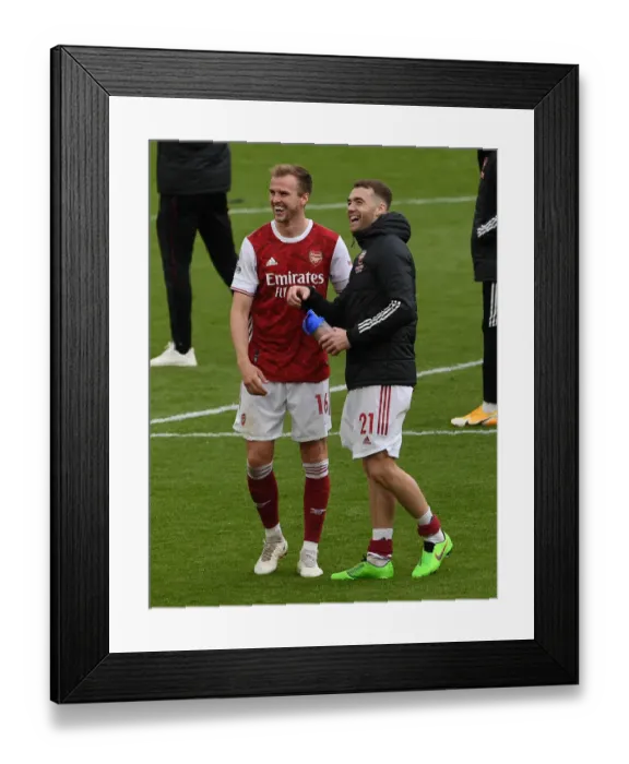 Framed Print : Arsenal's Holding and Chambers Celebrate Victory Over Brighton & Hove Albion (2020-21) Framed Print : Arsenal's Holding and Chambers Celebrate Victory Over Brighton & Hove Albion (2020-21)