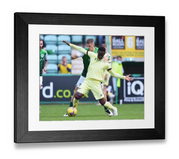 Framed Print : Hibernian vs Arsenal: Flo Balogun Faces Off Against Alex Gogic in Edinburgh's Pre-Season Clash Framed Print : Hibernian vs Arsenal: Flo Balogun Faces Off Against Alex Gogic in Edinburgh's Pre-Season Clash