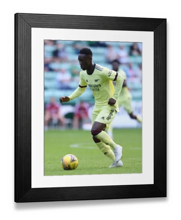 Framed Print : Arsenal's Flo Balogun in Action against Hibernian during 2021 Pre-Season Friendly in Edinburgh