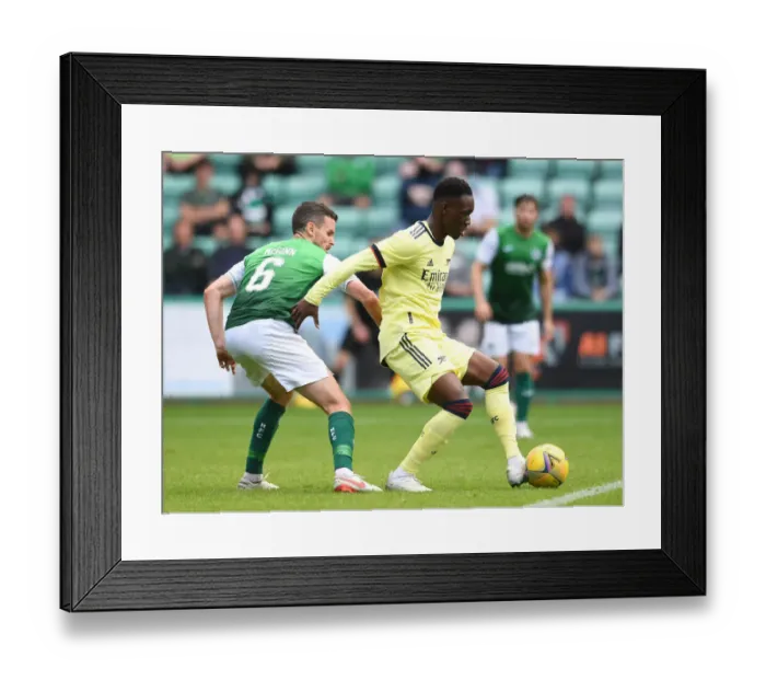 Framed Print : Hibernian vs Arsenal: Flo Balogun Faces Off Against Paul McGinn in Pre-Season Clash Framed Print : Hibernian vs Arsenal: Flo Balogun Faces Off Against Paul McGinn in Pre-Season Clash