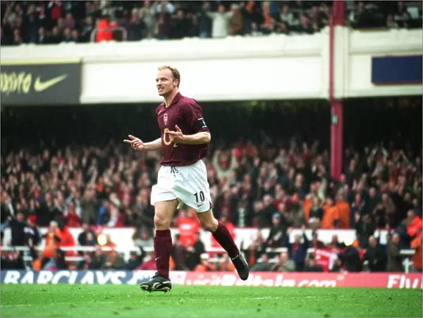 Dennis Bergkamp celebrates scoring the 3rd Arsenal goal