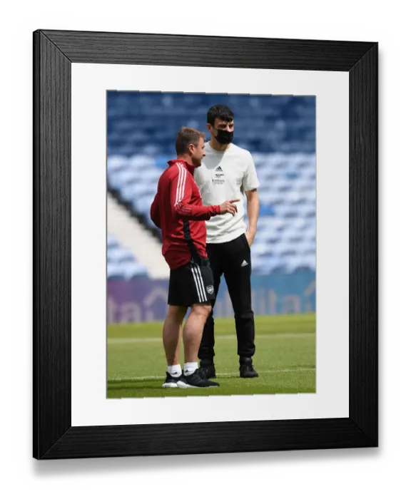 Framed Print : Arsenal's Pre-Season Showdown at Ibrox: Tom Smith and Inaki Cana in Deep Conversation Before the Rangers Face-Off