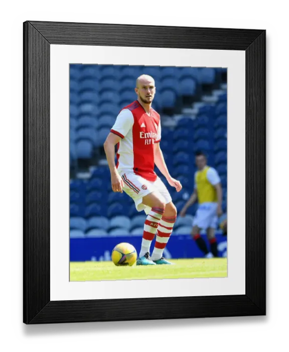 Framed Print : Arsenal's Rob Holding in Action Against Glasgow Rangers at Ibrox Stadium