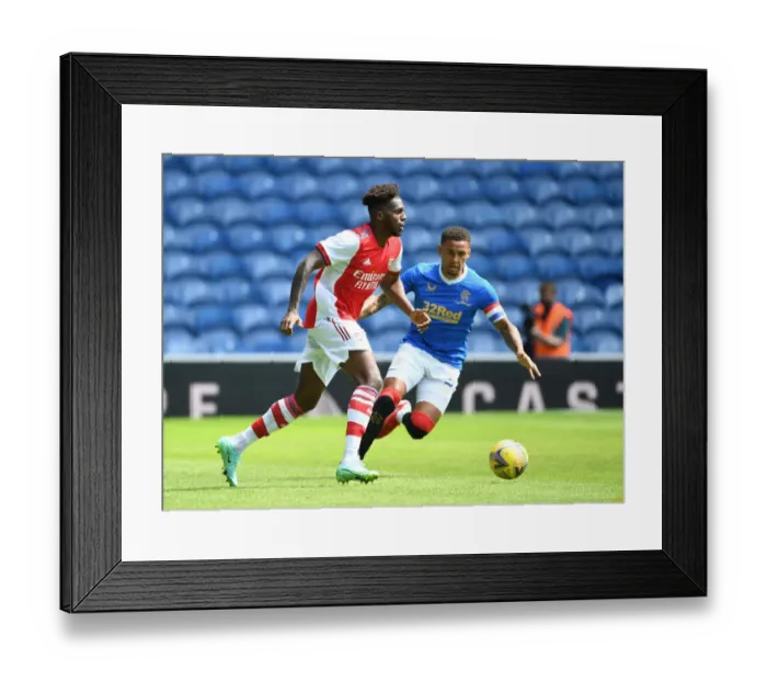 Framed Print : Nuno Tavares Breaks Past Rangers James Tavernier in Arsenal's Glasgow Pre-Season Victory Framed Print : Nuno Tavares Breaks Past Rangers James Tavernier in Arsenal's Glasgow Pre-Season Victory