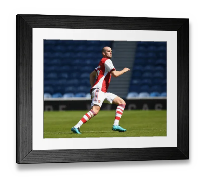 Framed Print : Arsenal's Rob Holding in Action against Glasgow Rangers at Ibrox Stadium