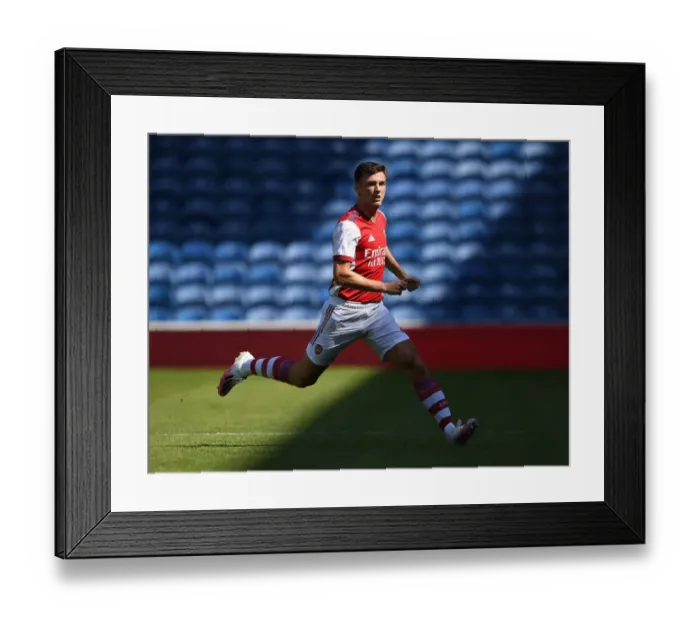 Framed Print : Arsenal's Kieran Tierney Goes Head-to-Head with Rangers at Ibrox Stadium