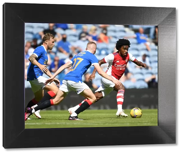 Willian Clashes with Rangers Airfield and Kelly in Arsenal's Pre-Season Friendly at Ibrox Stadium