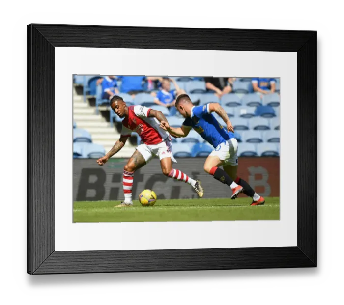 Framed Print : Reiss Nelson vs Scott Arfield: Clash at Ibrox - Rangers vs Arsenal Pre-Season Friendly