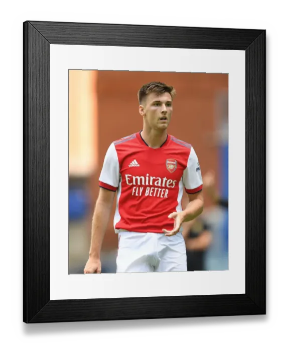Framed Print : Arsenal's Kieran Tierney Goes Head-to-Head with Rangers at Ibrox Stadium