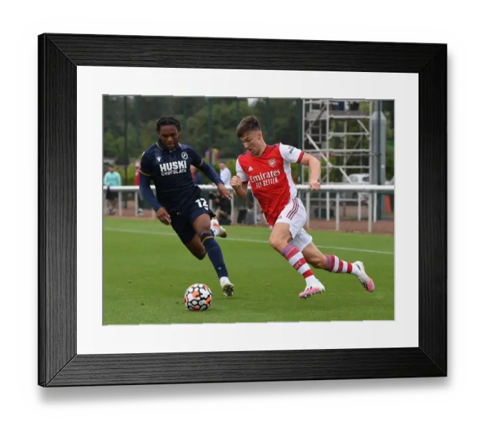 Framed Print : Arsenal's Kieran Tierney Stands Out in Arsenal's Pre-Season Victory over Millwall (2021-22)