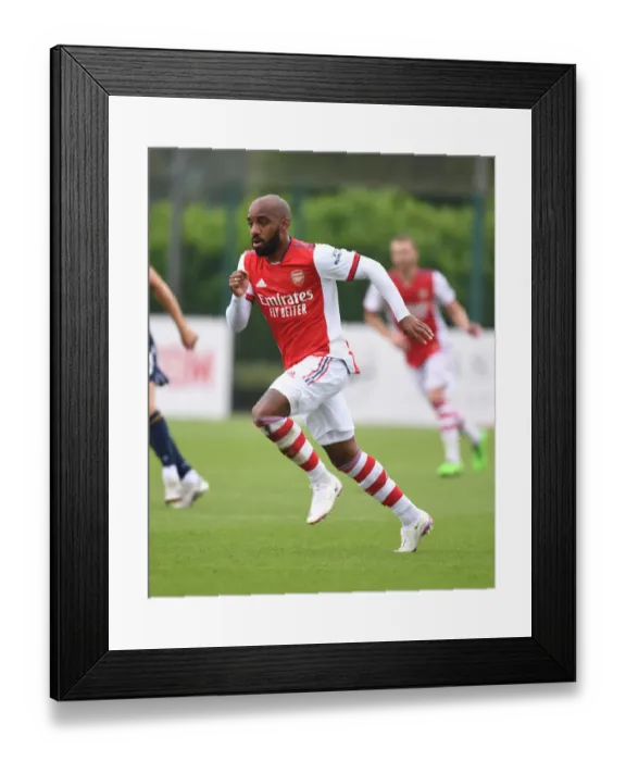 Framed Print : Arsenal's Alex Lacazette Shines in Pre-Season: Arsenal vs Millwall (2021-22)