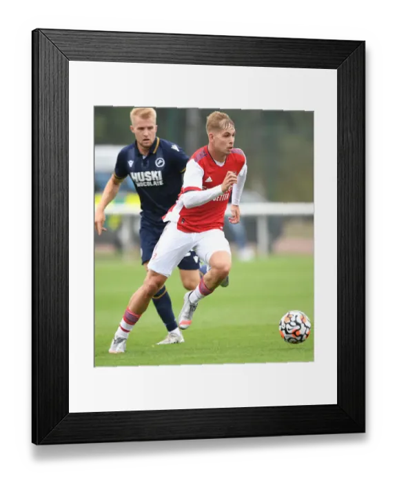 Framed Print : Arsenal's Emile Smith Rowe Outmaneuvers Millwall's Billy Mitchell in Pre-Season Friendly Framed Print : Arsenal's Emile Smith Rowe Outmaneuvers Millwall's Billy Mitchell in Pre-Season Friendly
