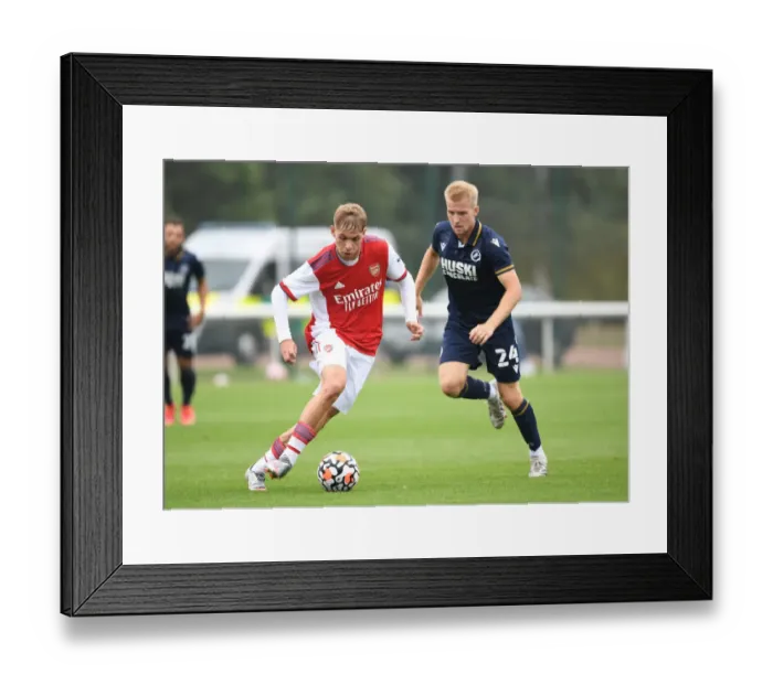 Framed Print : Emile Smith Rowe's Slick Moves: Outsmarting Millwall's Billy Mitchell in Arsenal's Pre-Season Victory Framed Print : Emile Smith Rowe's Slick Moves: Outsmarting Millwall's Billy Mitchell in Arsenal's Pre-Season Victory