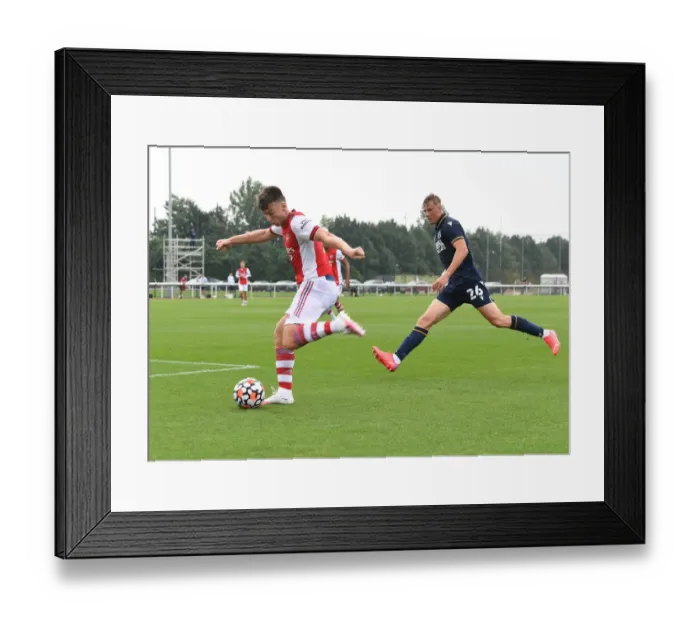 Framed Print : Arsenal's Kieran Tierney Faces Off Against Millwall's Daniel Ballard in Pre-Season Friendly