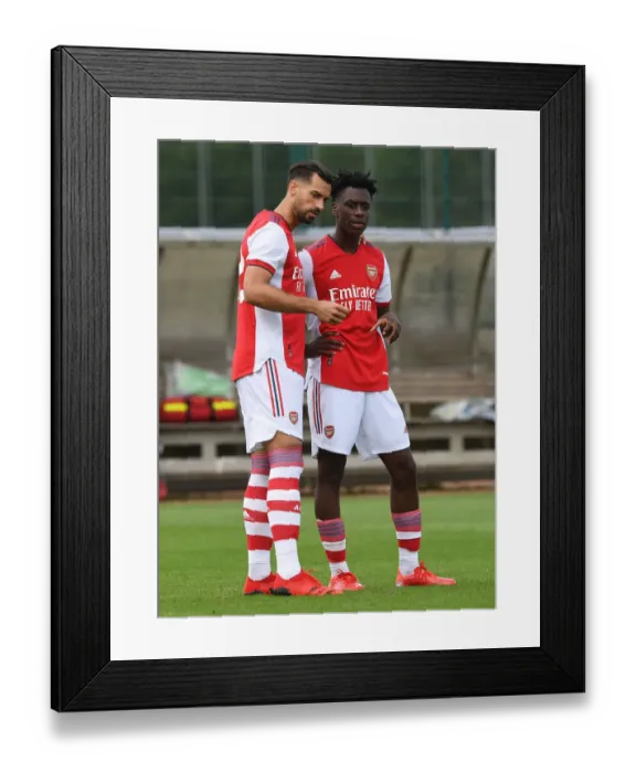 Framed Print : Arsenal Half-Time: Pablo Mari and Albert Sambi Lokonga in Deep Conversation during Arsenal v Watford Pre-Season Friendly