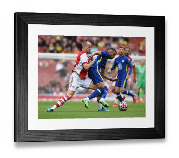 Framed Print : Clash of Minds: Arsenal vs. Chelsea - Rob Holding vs. Hakim Ziyech at the Emirates
