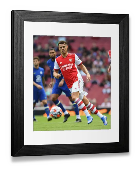 Framed Print : Arsenal's Granit Xhaka: Unyielding Performance Against Chelsea in Pre-Season Clash