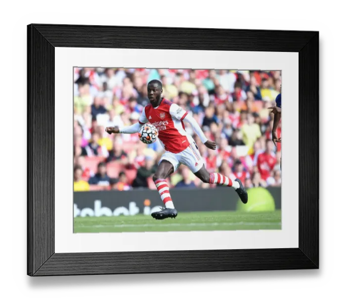 Framed Print : Pepe's Unwavering Determination: Arsenal vs Chelsea Clash at Emirates Stadium (2021-22 Pre-Season Friendly)