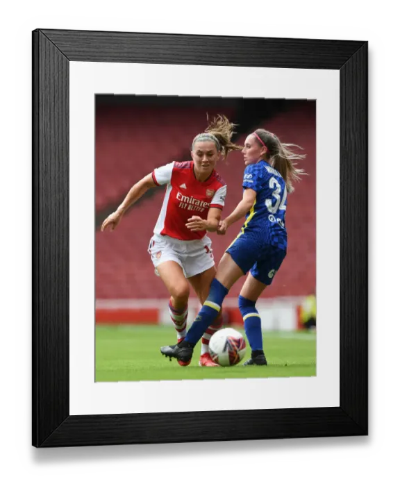 Framed Print : Intense Pre-Season Clash: Arsenal Women vs. Chelsea Women - McCabe Fouls Wardlaw at Emirates Stadium