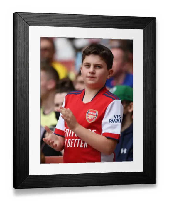 Framed Print : Young Arsenal Fan Shows Support Amidst 1:2 Defeat against Chelsea at The Emirates, 2021