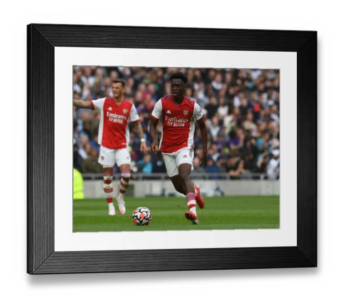 Framed Print : Arsenal's Albert Sambi Lokonga: Unwavering Concentration Amidst Premier League Rivalry (Arsenal vs. Tottenham Hotspur)