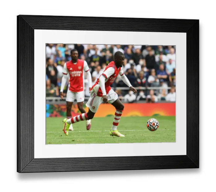 Framed Print : Arsenal vs. Tottenham Showdown: Nicolas Pepe's Mind-Bending Performance at Tottenham Stadium