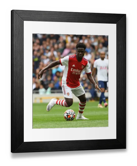 Framed Print : Bukayo Saka in Action: Tottenham vs. Arsenal - The Mind Series: A Football Battle in London