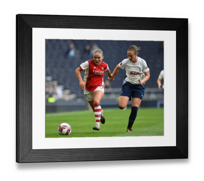 Framed Print : Clash on the Pitch: Tottenham Hotspur Women vs. Arsenal Women - Battle for Supremacy in the MIND Series
