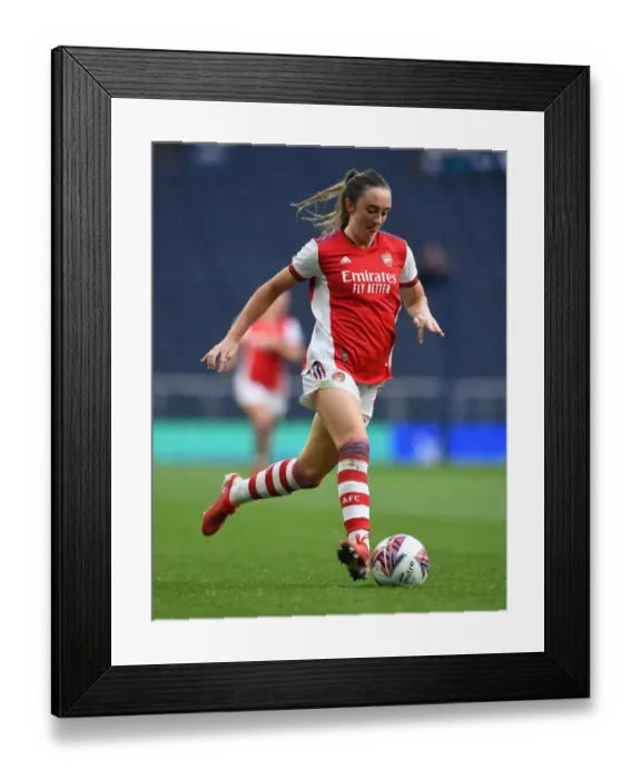 Framed Print : Arsenal's Lisa Evans Goes Head-to-Head with Tottenham Hotspur in Exciting Women's Football Clash