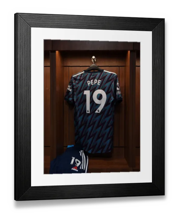 Framed Print : Arsenal's Nicolas Pepe Jersey in Brentford Changing Room - Brentford vs Arsenal, 2021-22 Premier League