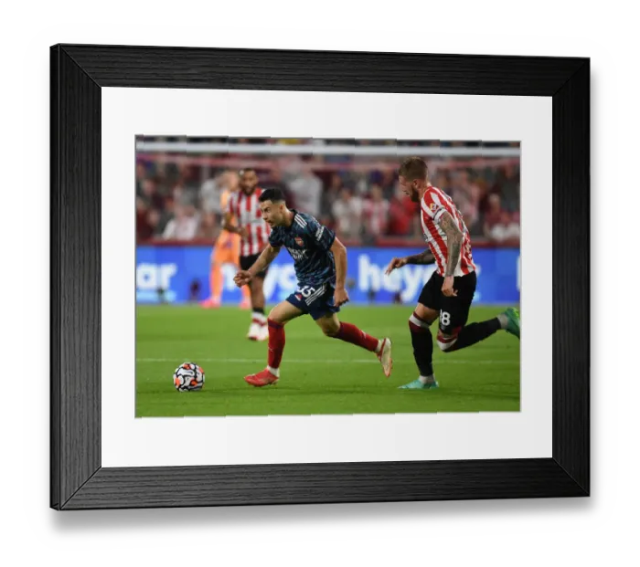 Framed Print : Martinelli vs Jansson: A Premier League Battle at Brentford Community Stadium