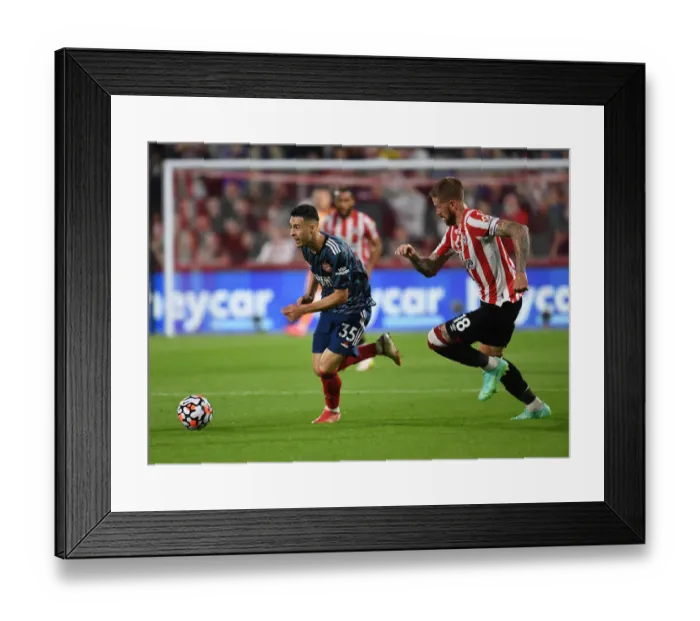 Framed Print : Gabriel Martinelli Clashes with Pontus Jansson: Brentford vs Arsenal, Premier League 2021-22