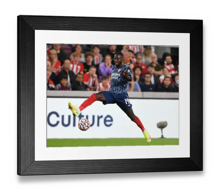 Framed Print : Nicolas Pepe in Action: Brentford vs Arsenal, Premier League 2021-22
