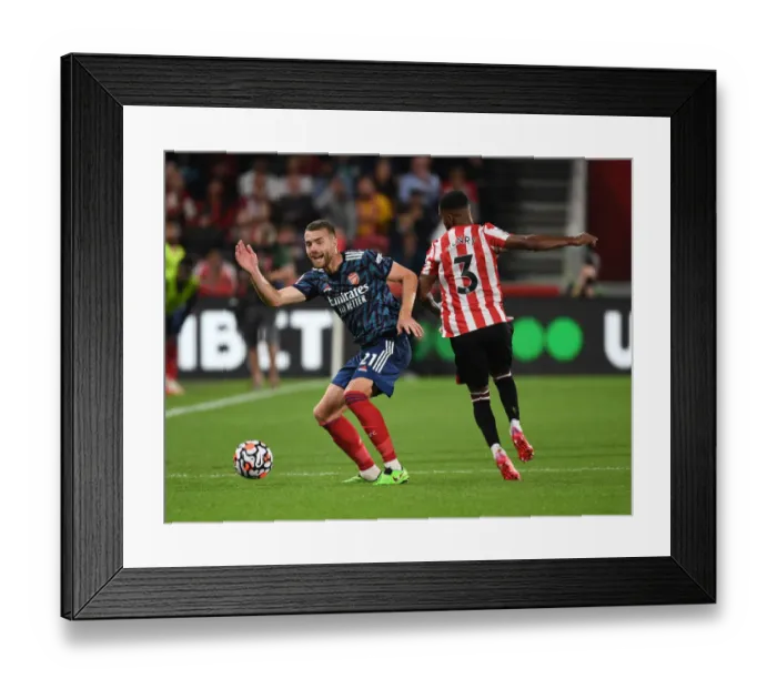 Framed Print : Chambers vs. Henry: Intense Battle in Brentford vs. Arsenal Premier League Clash