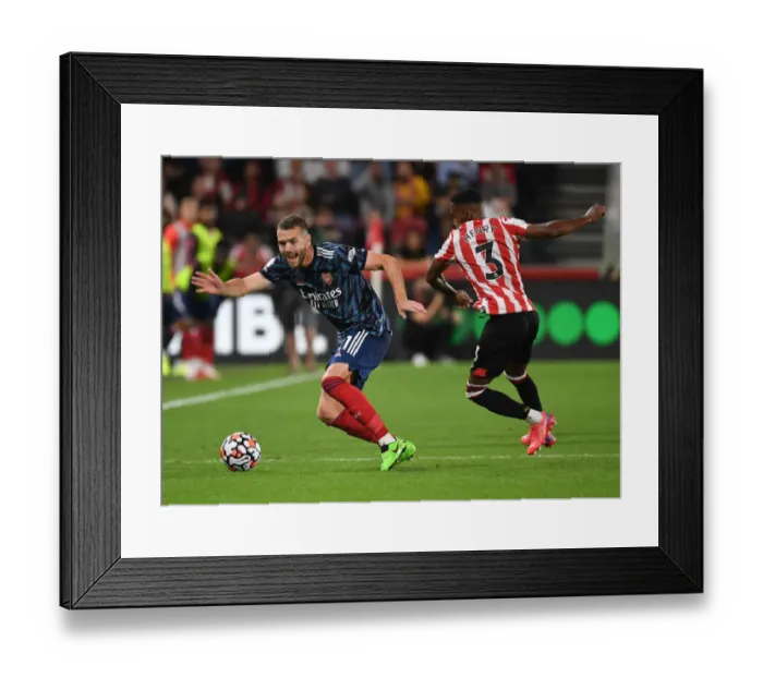 Framed Print : Arsenal's Chambers vs. Henry: A Premier League Battle at Brentford Community Stadium