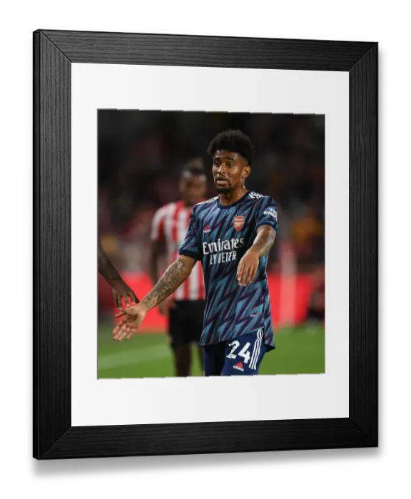 Framed Print : Arsenal's Reiss Nelson in Action against Brentford in 2021-22 Premier League Framed Print : Arsenal's Reiss Nelson in Action against Brentford in 2021-22 Premier League