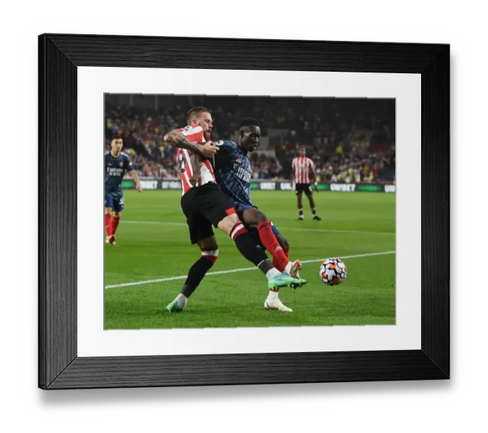 Framed Print : Brentford vs Arsenal: Flo Balogun Clashes with Pontus Jansson in Premier League Showdown Framed Print : Brentford vs Arsenal: Flo Balogun Clashes with Pontus Jansson in Premier League Showdown