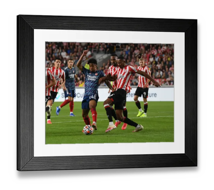 Framed Print : Brentford vs Arsenal: Nelson vs Pinnock Clash in Premier League Showdown