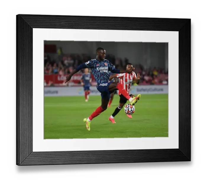 Framed Print : Nicolas Pepe in Action: Brentford vs Arsenal, Premier League 2021-22 Framed Print : Nicolas Pepe in Action: Brentford vs Arsenal, Premier League 2021-22