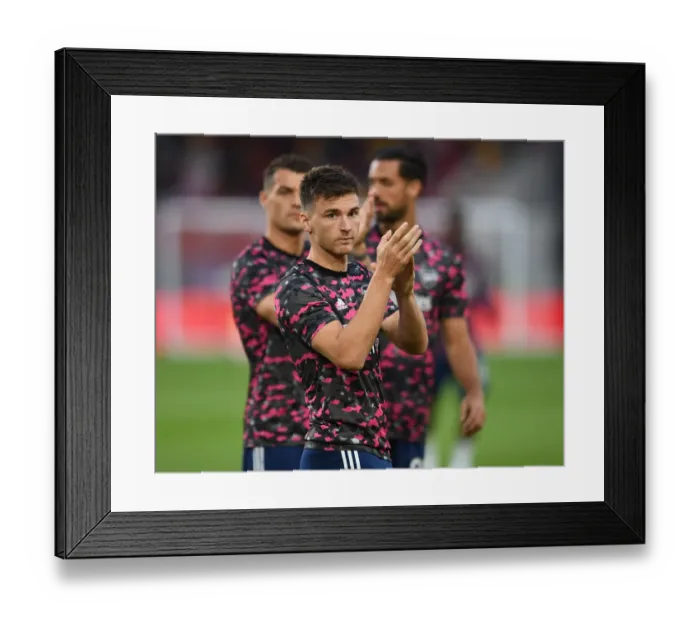 Framed Print : Arsenal's Kieran Tierney Rallies Fans Before Brentford Clash in Premier League