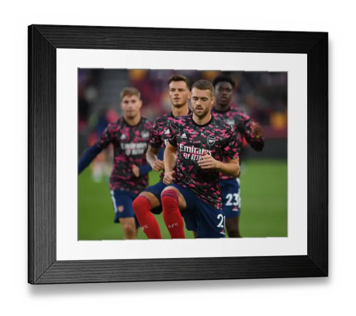 Framed Print : Arsenal's Calum Chambers Warming Up Ahead of Brentford Clash - Premier League 2021-22