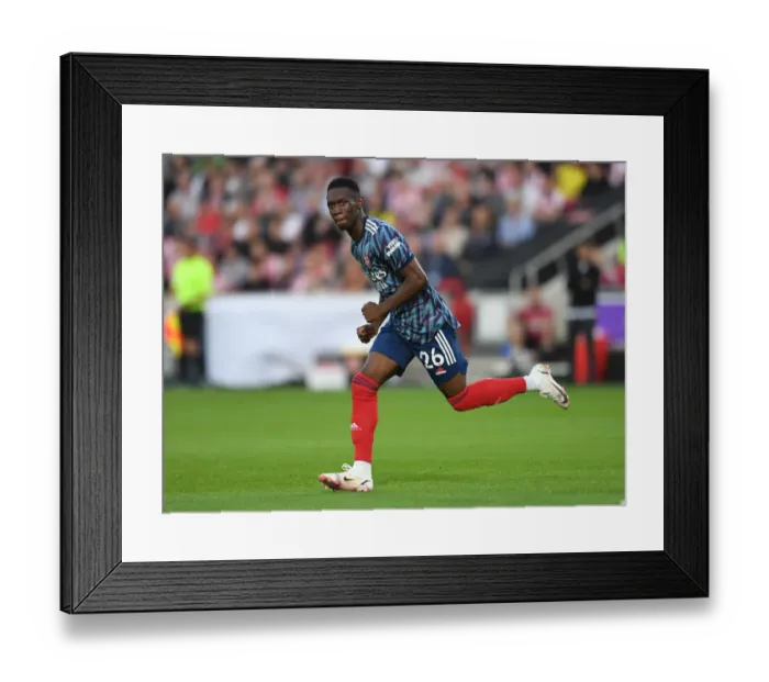 Framed Print : Arsenal's Flo Balogun in Action against Brentford in 2021-22 Premier League Framed Print : Arsenal's Flo Balogun in Action against Brentford in 2021-22 Premier League